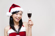 © taka - a portrait of santa girl taking a red wine