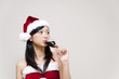 © taka - a portrait of santa girl taking a red wine