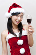 © taka - a portrait of santa girl taking a red wine