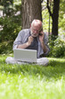 © STUDIO GRAND WEB - homme sénior préoccupé avec portable pc téléphone