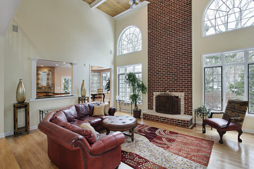 Family room with two story brick fireplace