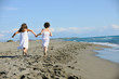 © .shock - cute little girls running on beach