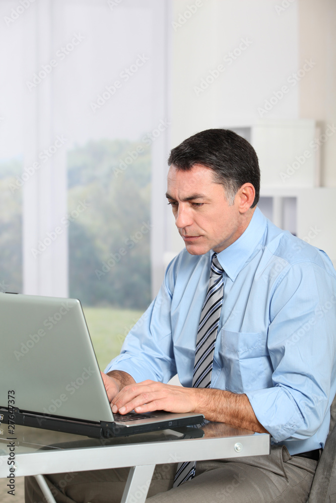 Businessman working on laptop computer