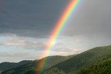 Fototapeta Tęcza - Rainbow in mountains