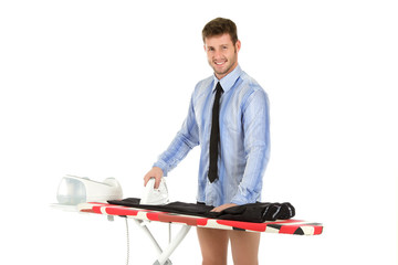 Young caucasian man ironing