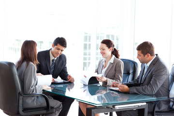 Four business people during a meeting