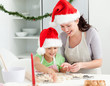© WavebreakMediaMicro - Lovely mother and daughter preparing Christmas cookies
