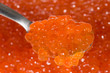 Spoon with red caviar (fish roe)