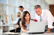© goodluz - Manager and secretary working in the office