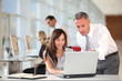 © goodluz - Manager and secretary working in the office