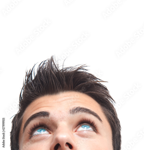 Fotografía Handsome man with blue eyes looking up isolated on white