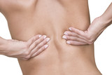 Fototapeta  - Woman massaging lower back pain