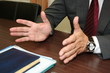 Hands of businessman giving an interview being recorded