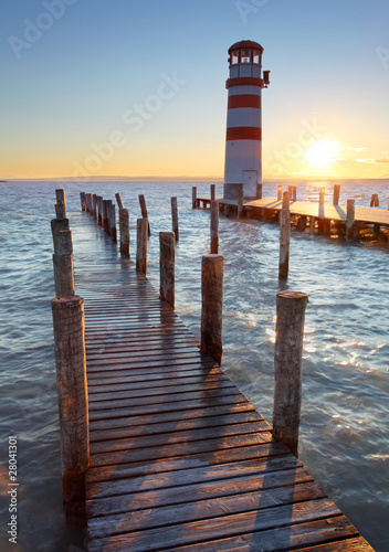 Naklejka dekoracyjna Lighthouse at Lake Neusiedl at sunset