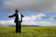 © Tom Wang - Relaxation businessman standing on the meadow