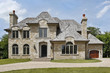 © pics721 - Luxury stone home with arched entryway