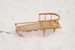 Wooden sledge in the snow