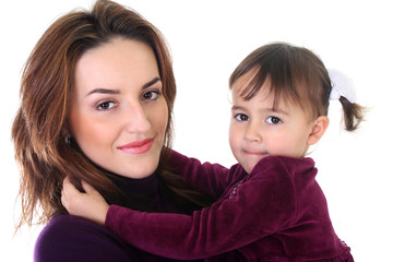 Portrait of smiling mother and daughter in violet