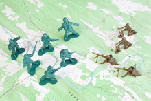 Plastic Army Men Fighting On Topographic Map General's View