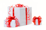 Fototapeta  - A white box tied with a red satin ribbon bow. A gift for Christm