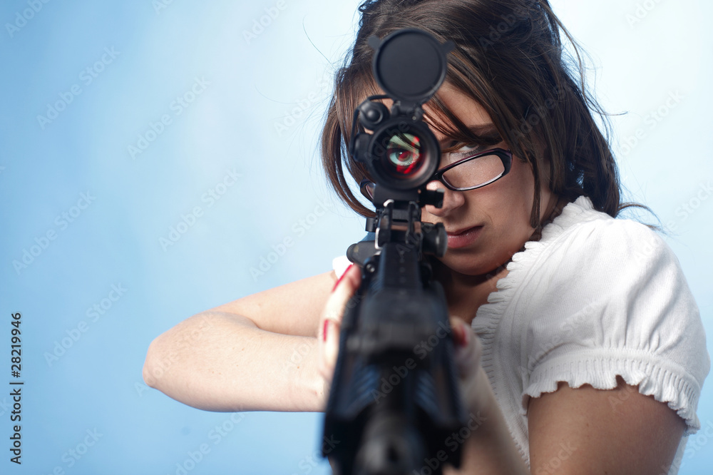 Sexy woman aiming an assault rifle Stock Photo | Adobe Stock