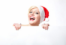 Cheerful Santa Woman Holding Empty White Board