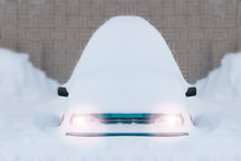 Car Buried Under Snow