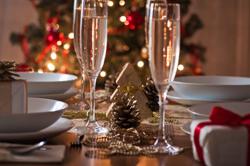 Wall Mural - A decorated christmas dining table with champagne glasses