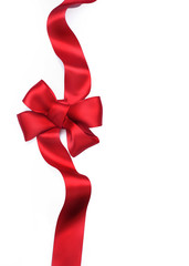 Wall Mural - Red satin gift bow. Ribbon. Isolated on white