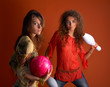 © bereta - young women holding bowling ball
