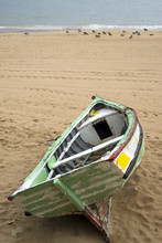 Old Rowboat Up On Beach