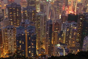Fototapete - Aerial view over highrise buildings at night
