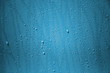 Water drop on the blue wall