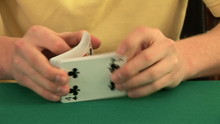 Hands On A Poker Table Shuffling A Deck Of Cards And Dealing