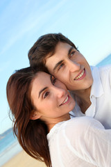  Portrait of lovely couple at the beach in summer