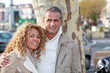 © goodluz - Portrait of happy mature couple in town