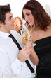 © goodluz - Couple celebrating new year's eve with champagne