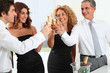 © goodluz - Group of friends cheering with glasses of champagne