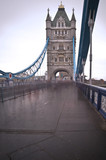 Fototapeta Londyn - Unusual view of Tower Bridge in London with blurred pedestrians