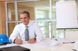 © goodluz - Portrait of architect in the office