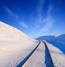 Winter Railway Among A Snowbound Fields