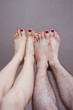 © arthurhidden - male and female legs with lacquered nails