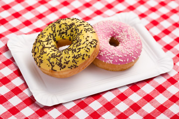 sweet doughnuts on paper plate