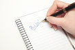 © Minerva Studio - Business woman writing 'profits' on her agenda
