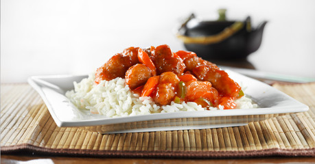 Wall Mural - sweet and sour pork on rice wide shot