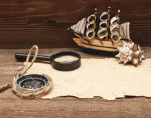 Old Paper And Model Classic Boat On Wood Background