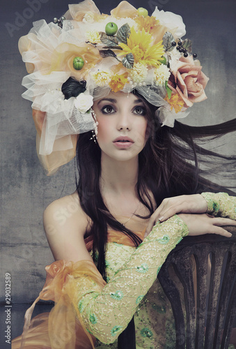 Plakat na zamówienie Stunning brunette beauty sitting on a chair