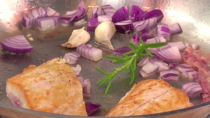 Canvas Print - frying fish with bacon and onions