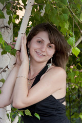 young girl near a birch