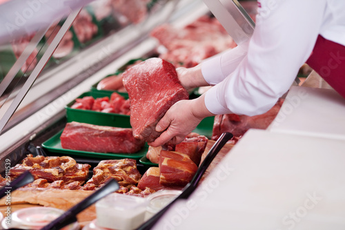 Cuadros en Lienzo verkäuferin mit frischem fleisch